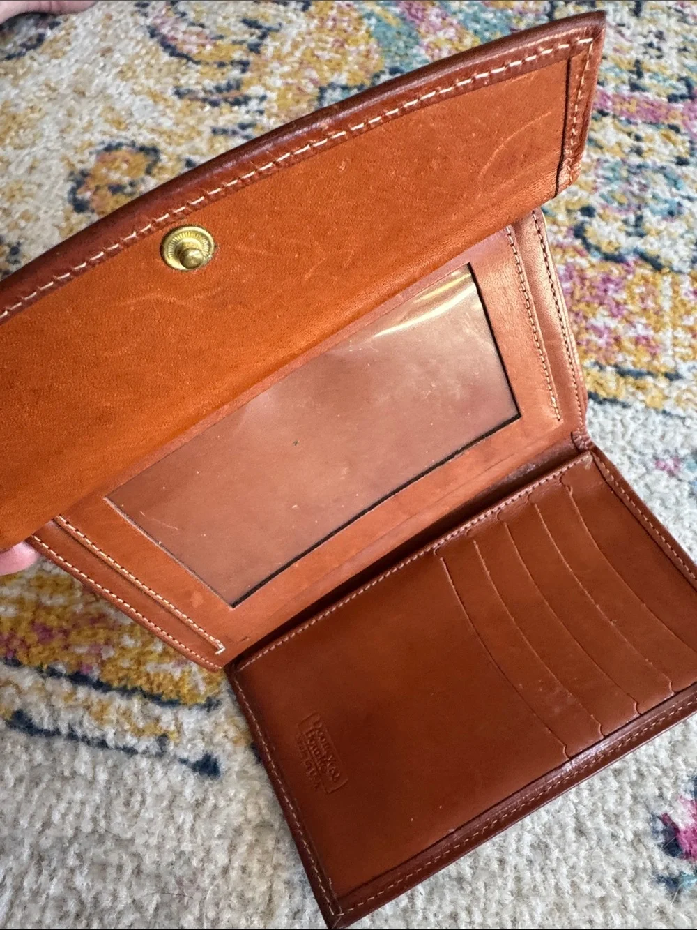 Dooney & Bourke Black Pebbled Leather Wallet with Brown Trim